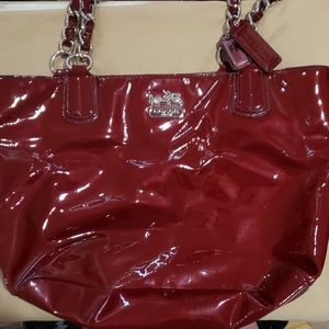 Coach designer bag Color is a deep red/maroon